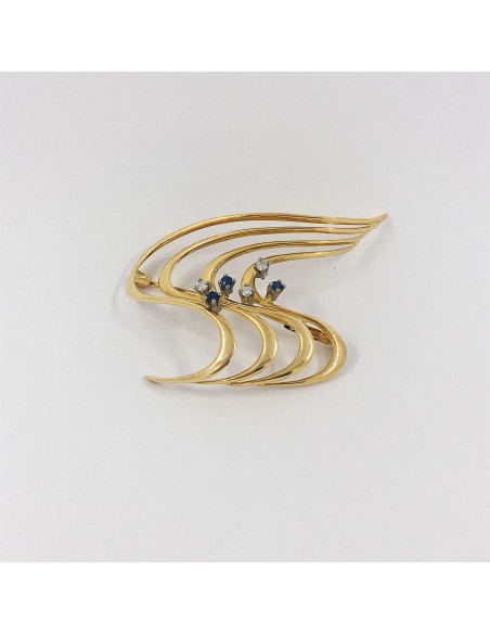 Broche en oro con brillantes.