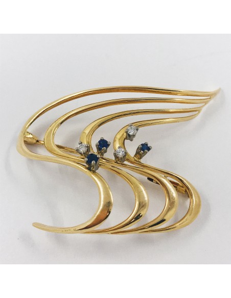 Broche en oro con brillantes.