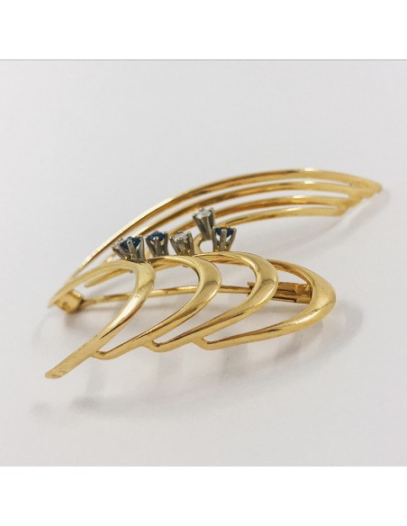 Broche en oro con brillantes.