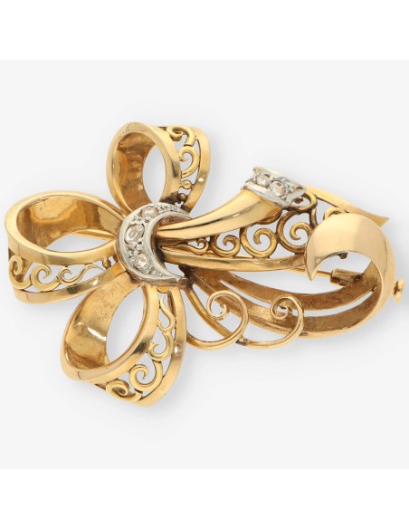 Aguja oro y diamantes