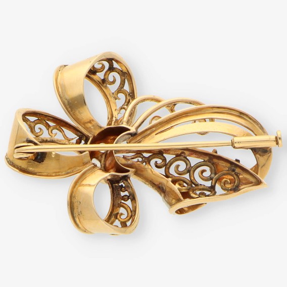 Aguja oro y diamantes