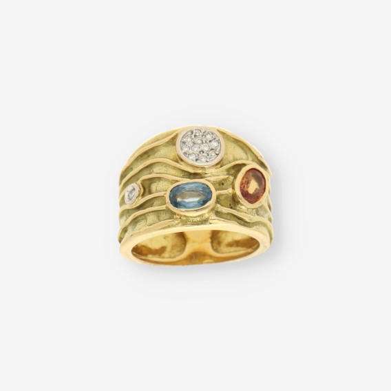 Anillo p. azul, p. naranja, oro y bri.