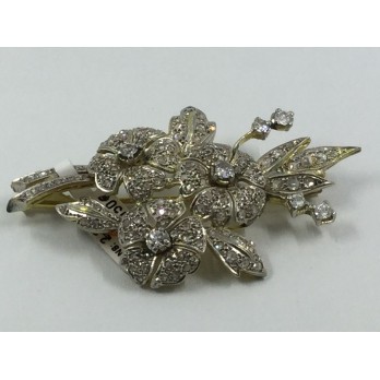 Broche en oro blanco y amarillo cuajado de brillantes.