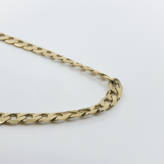 Cadena barbada plana en oro 18kt