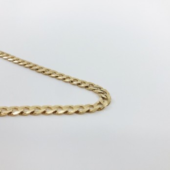 Cadena barbada plana en oro 18kt 2