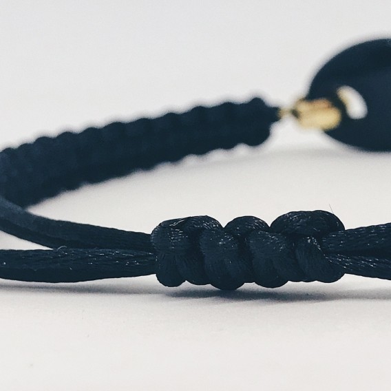 Pulsera  de  cordÃ³n trenzado con oro 18kt