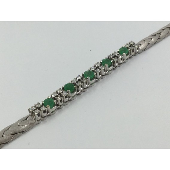 Pulsera en oro blanco mate con centro de brillantes y esmeraldas
