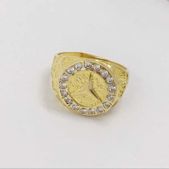 Sello con el sÃ­mbolo de Mercedes-Benz en oro 18kt